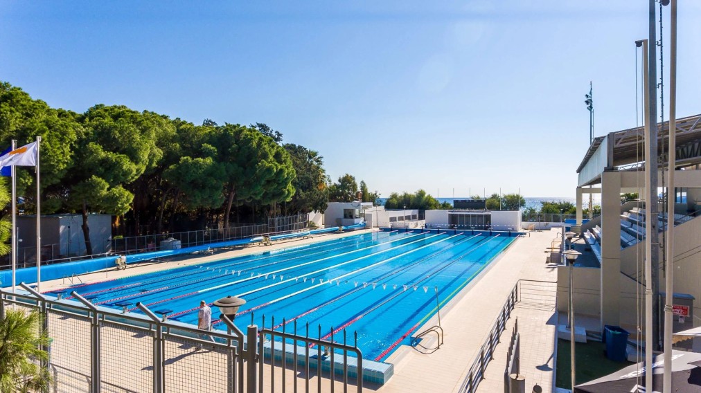 Olympic 50m pool — poolside view with sea horizon