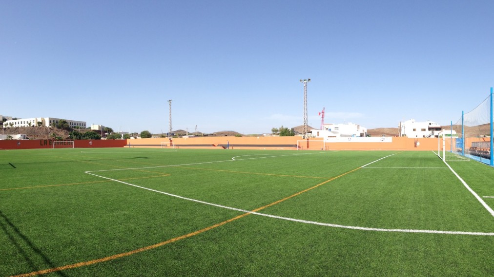 Full-size outdoor football pitch with artificial turf