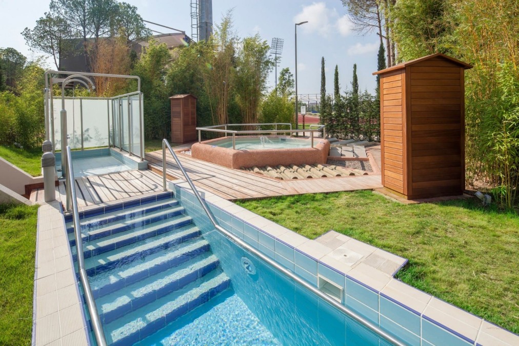 Outdoor cold plunge pool with hydrotherapy tub and sauna