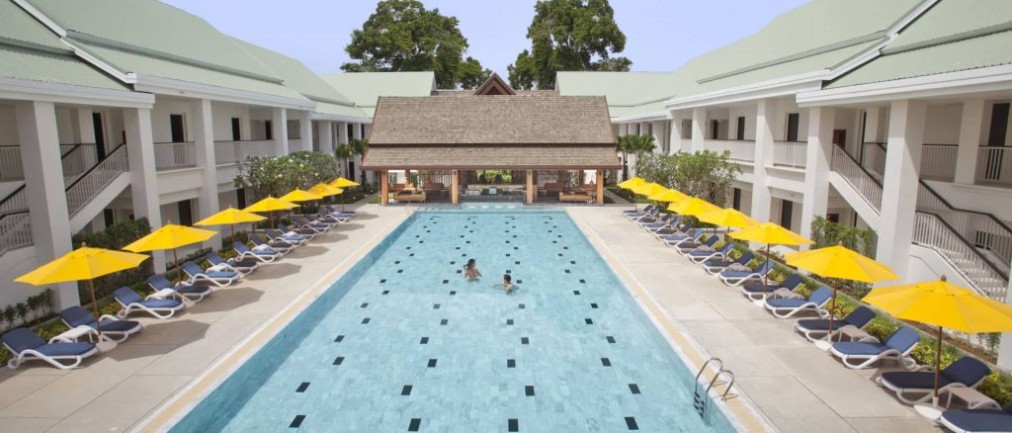 Outdoor pool at the hotel with sun loungers