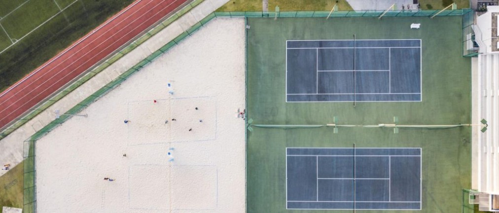 Sand volleyball courts and tennis courts, aerial view