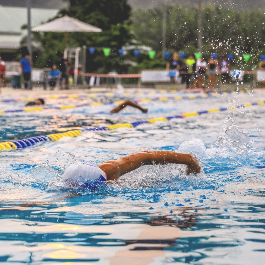 Swimmer training in an outdoor lap pool
