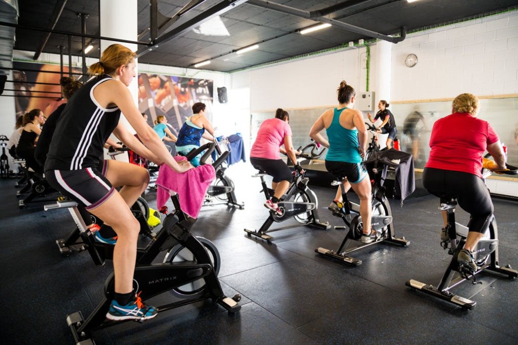 Indoor cycling class on stationary bikes