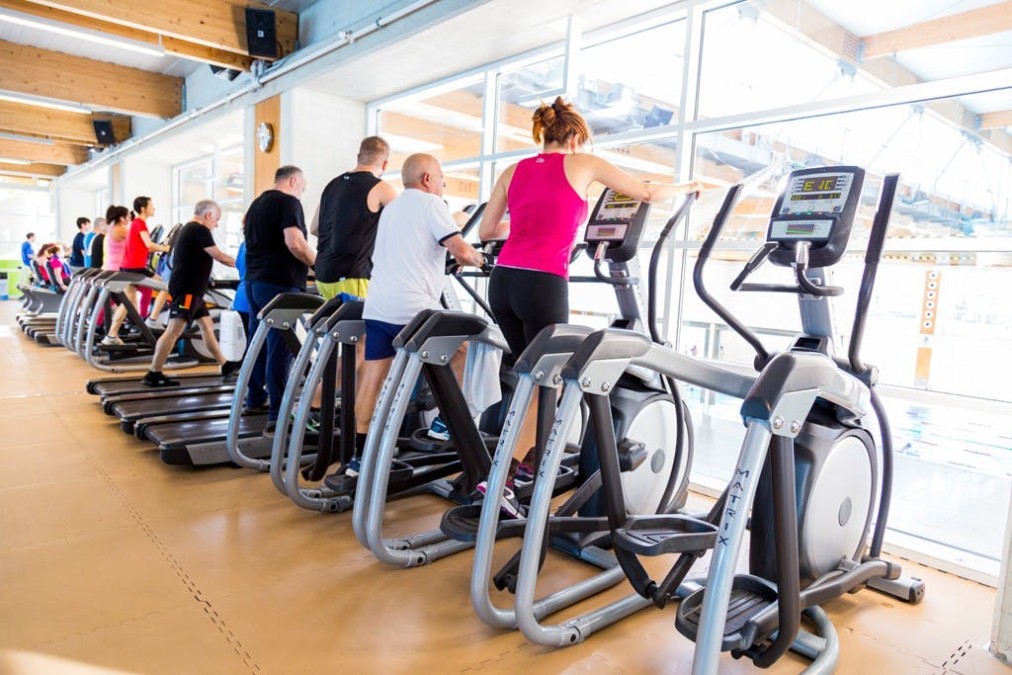 Cardio machines overlooking the pool hall