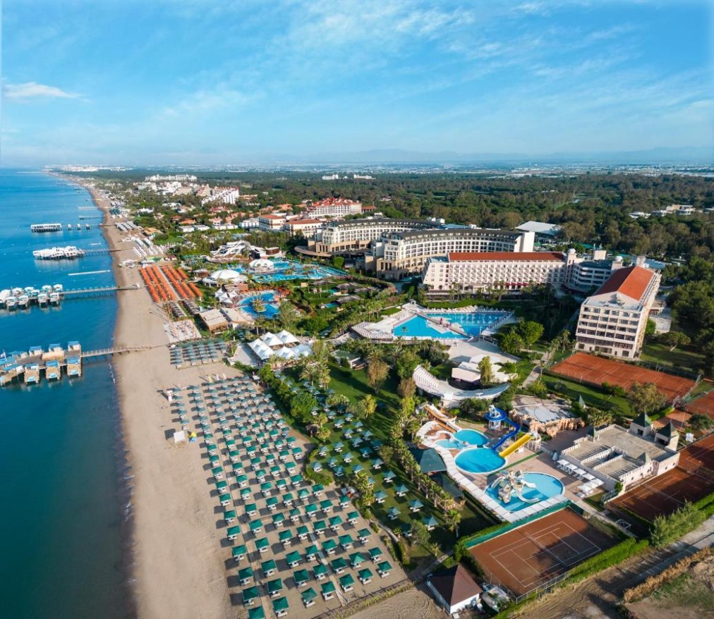 Aerial view of Kaya Belek resort complex with beach and tennis courts