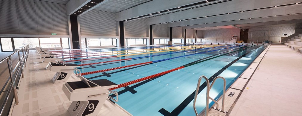 Indoor pool with starting blocks, wide view