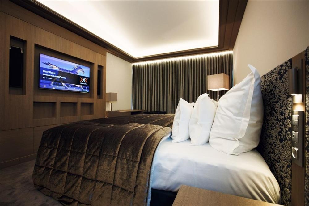 Hotel room with wall-mounted TV
