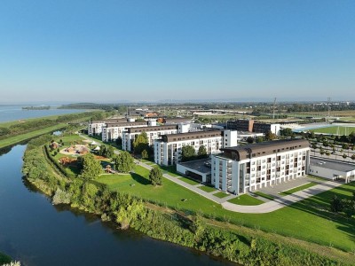 Hotel accommodation blocks by the river, aerial view