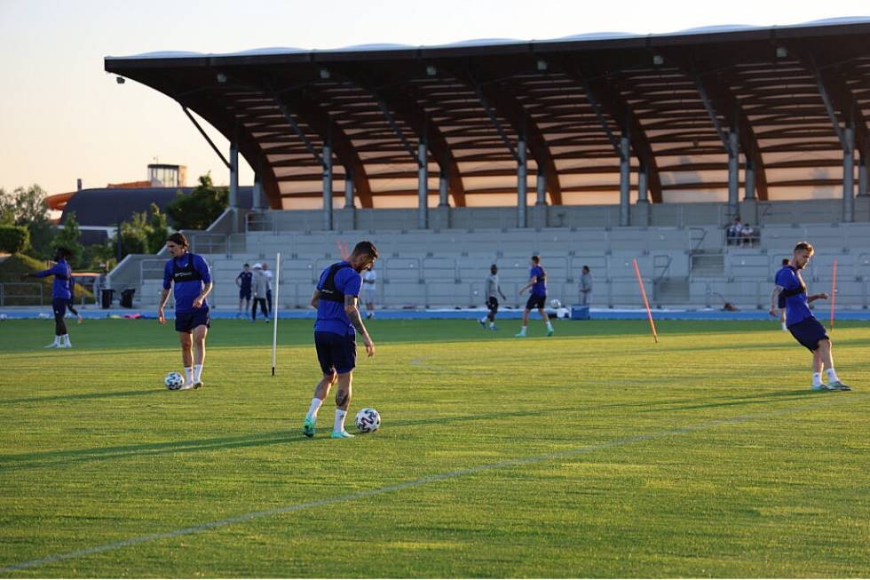 Football training at sunset, stadium backdrop