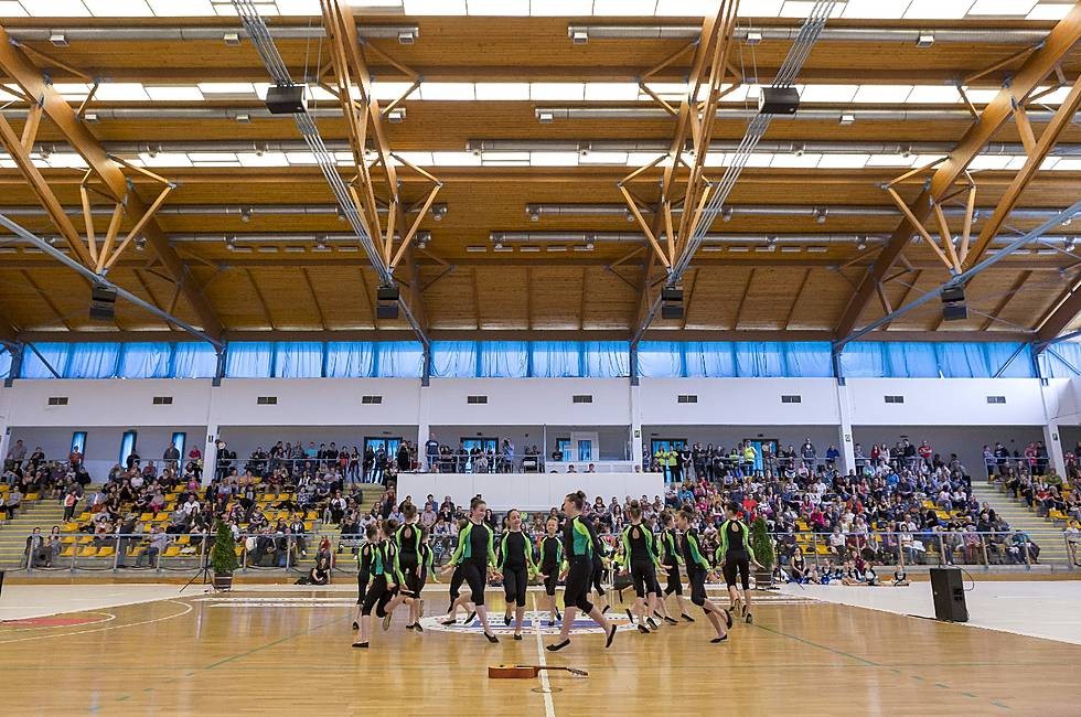 Indoor arena with dance performance and crowd