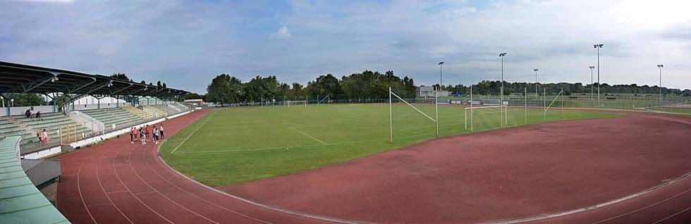 Athletics track alongside football pitch
