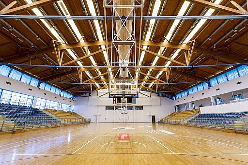 Indoor basketball arena with tiered seating
