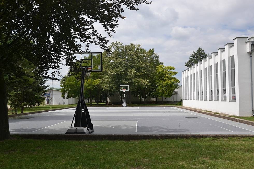 Outdoor basketball court with two hoops