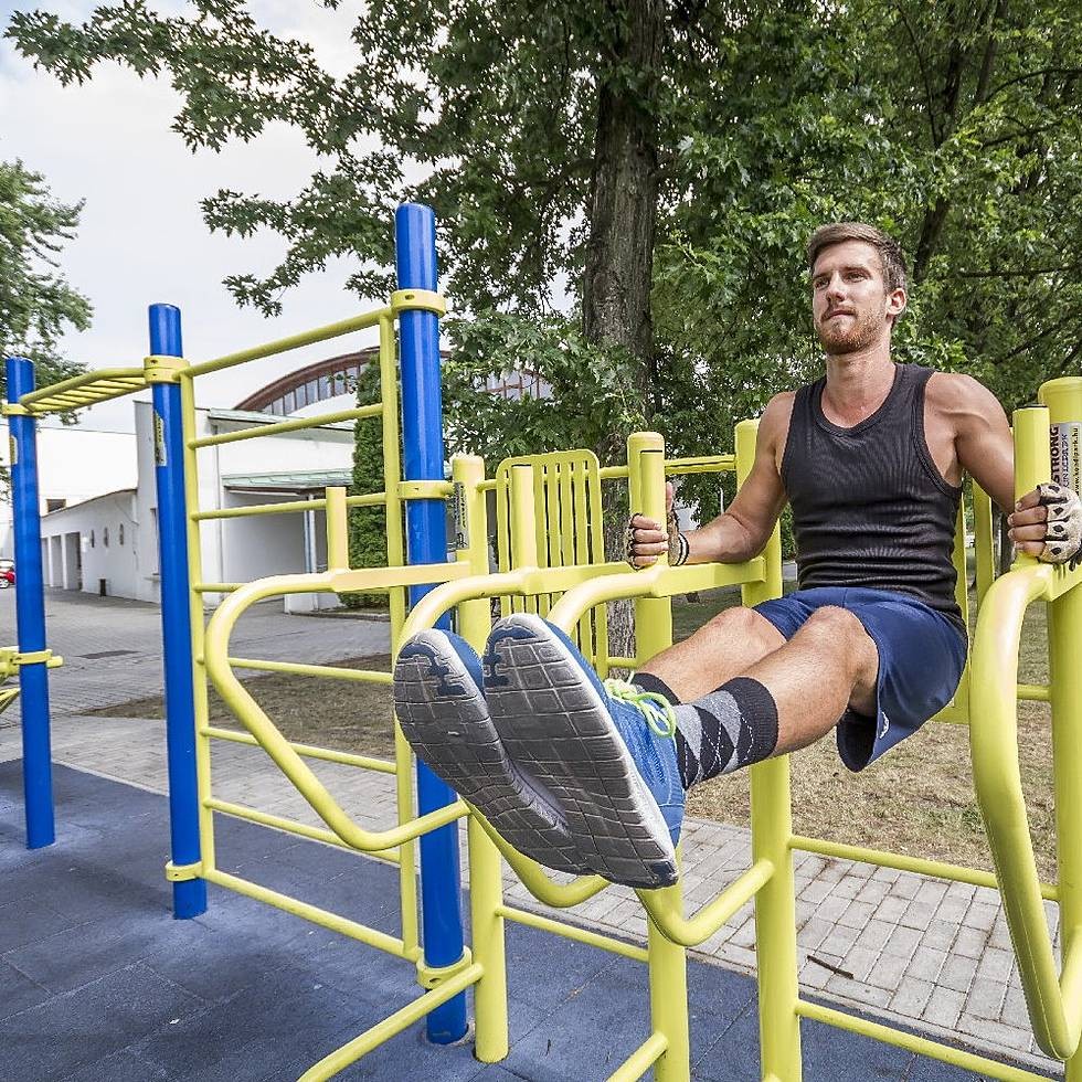 Outdoor calisthenics station in use