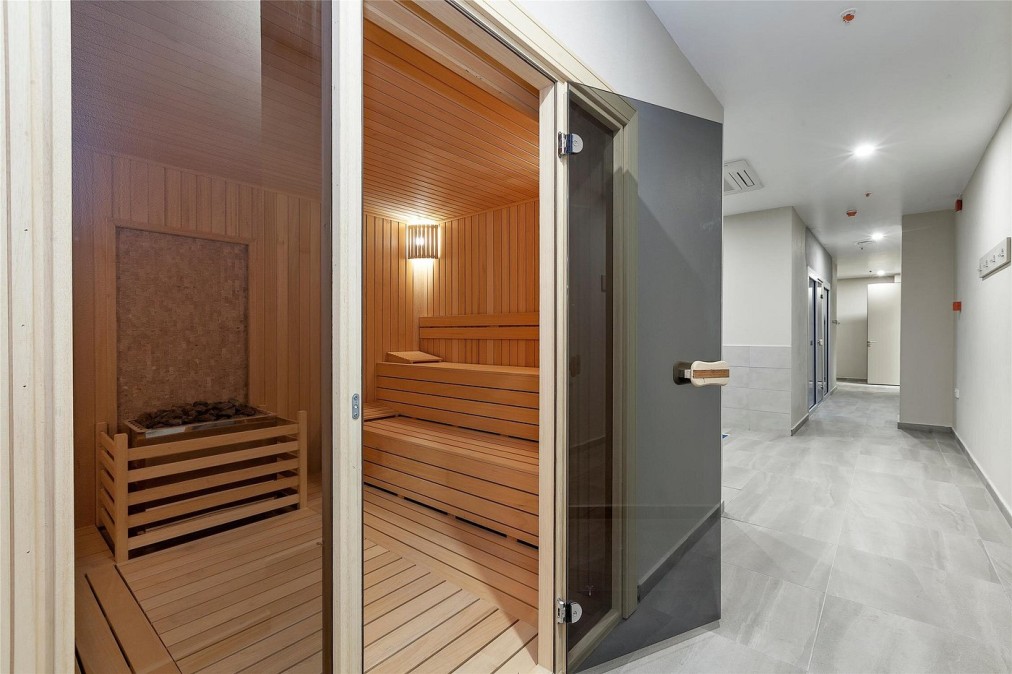 Wooden sauna room with bench seating
