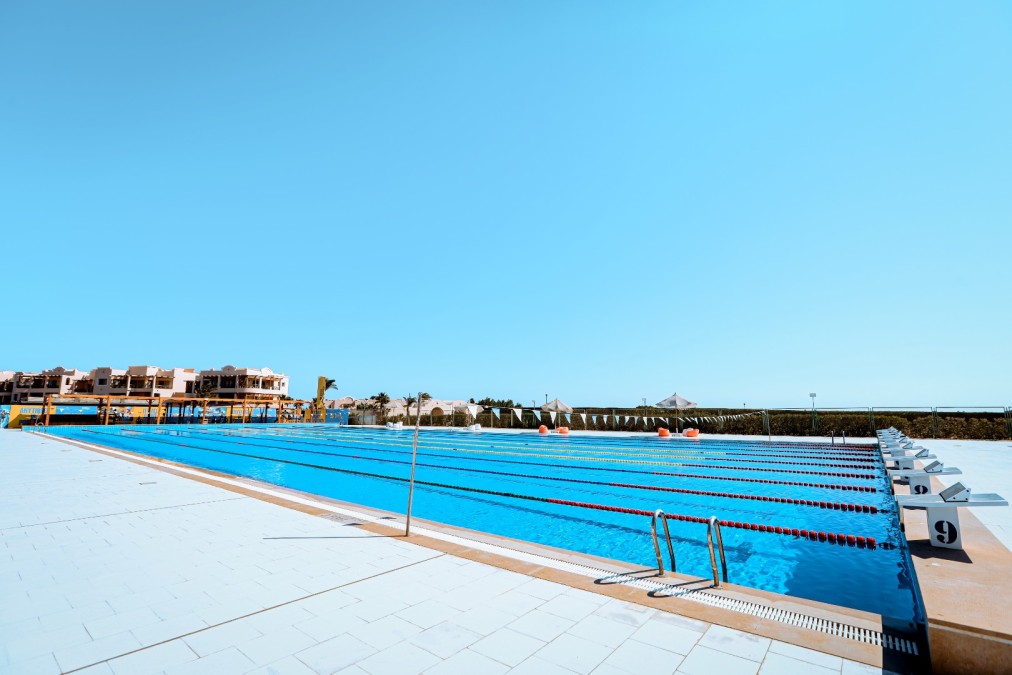 50m outdoor pool — side view with 10 lanes and starting blocks
