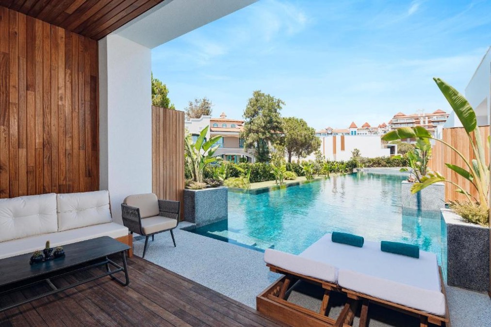 Private terrace with loungers beside a plunge pool.