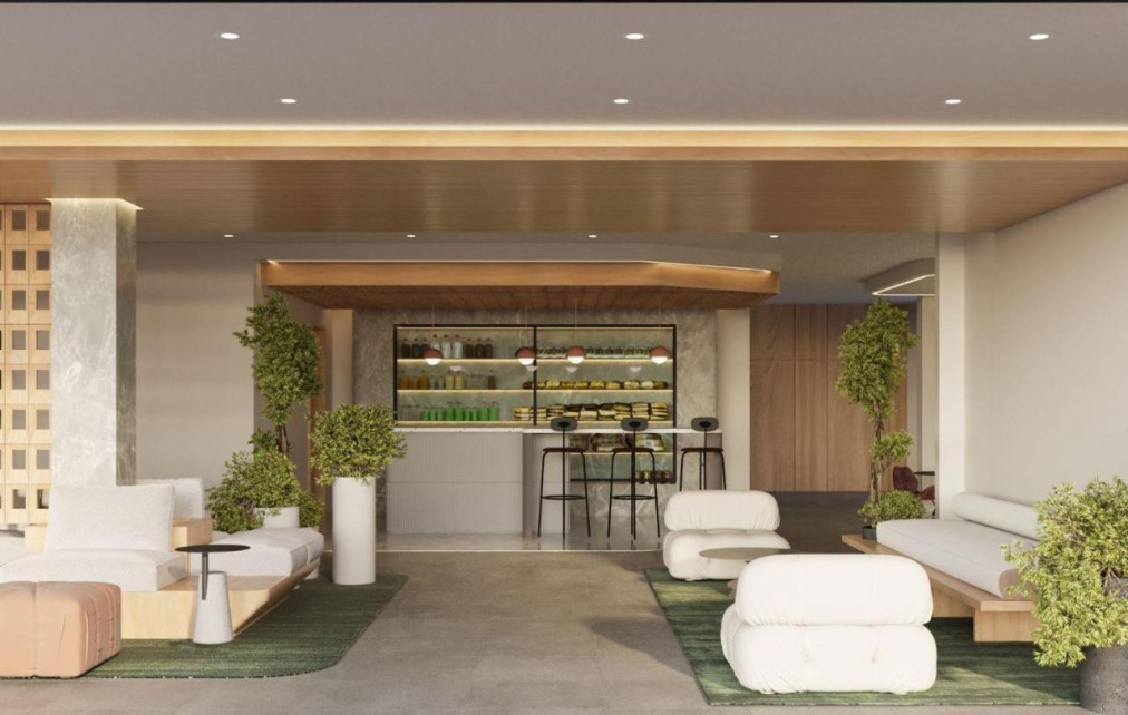 Resort bar area with seating, plants, and modern lighting