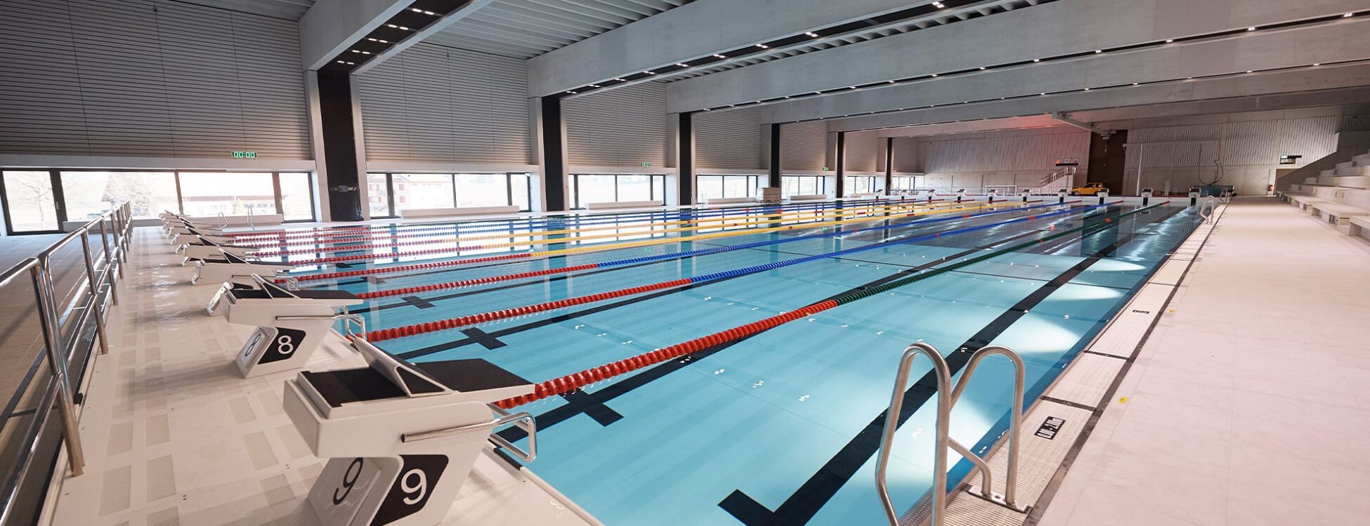 Indoor pool with starting blocks, wide view
