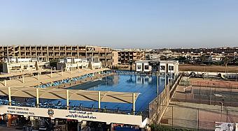 Aerial view of Marine Club complex with Olympic pool and tennis courts