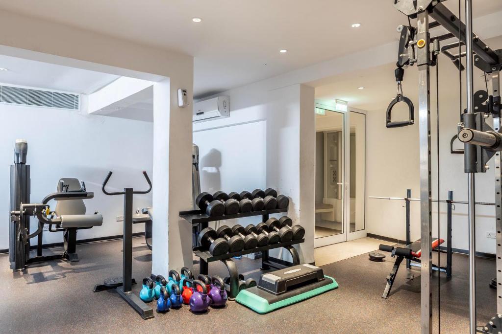 Dumbbell rack, kettlebells, leg machine, and cable station
