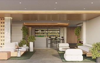 Resort bar area with seating, plants, and modern lighting