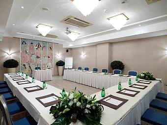 Conference room in U-shape setup for team meetings and briefings.