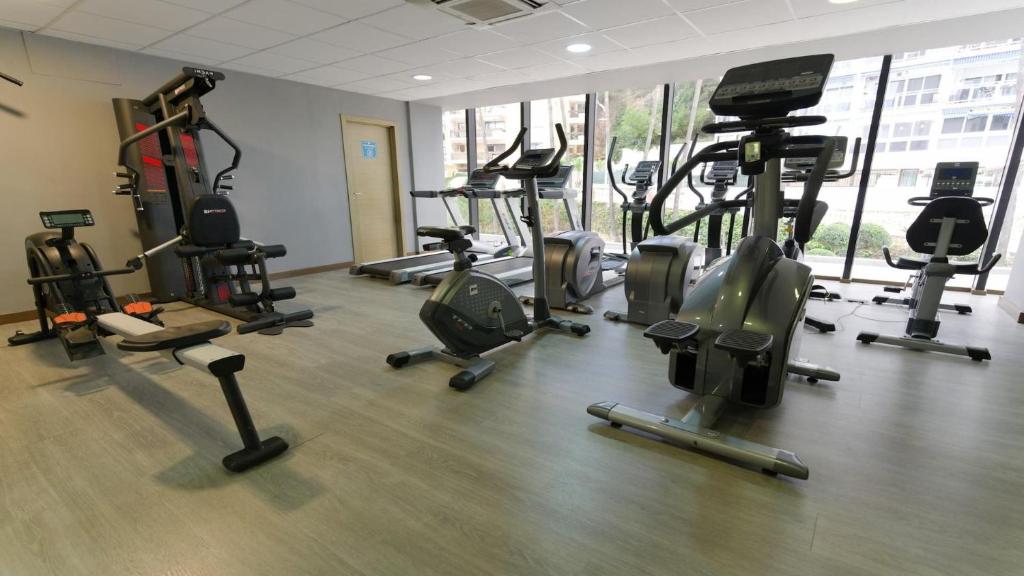 Fitness room with cardio machines and strength equipment.
